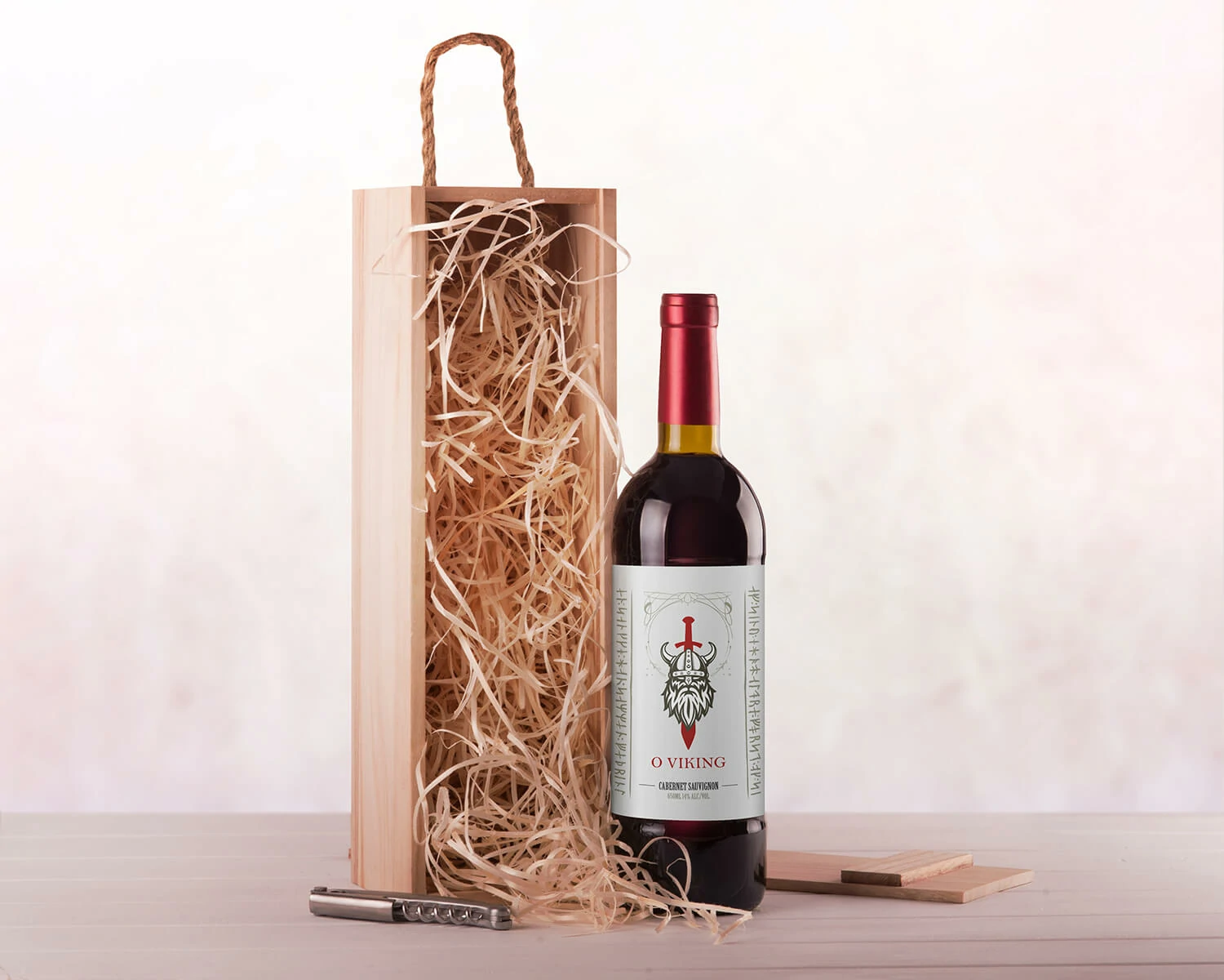 O Viking wine bottle beside a wooden gift box